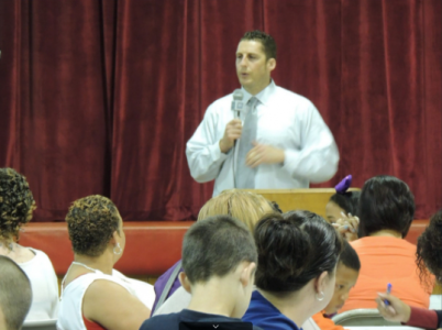 Dr. Jeff Adams, principal of walnut st. elementary school, in woodbury, nj is speaking at their mother's program.